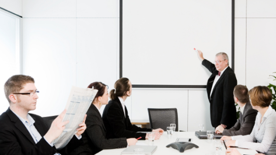 People in dress suits at board meeting